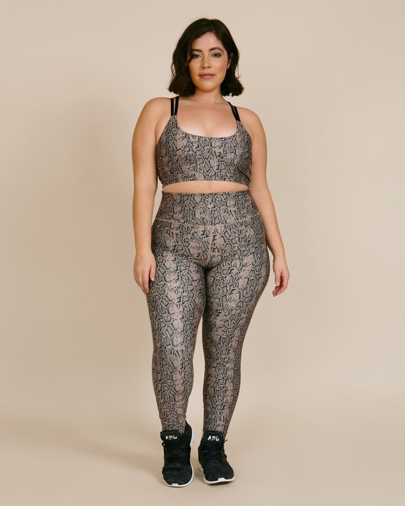 Front of a model wearing a size 4 Core Power Legging Nude Snake in Nude Snake by Good American. | dia_product_style_image_id:224823